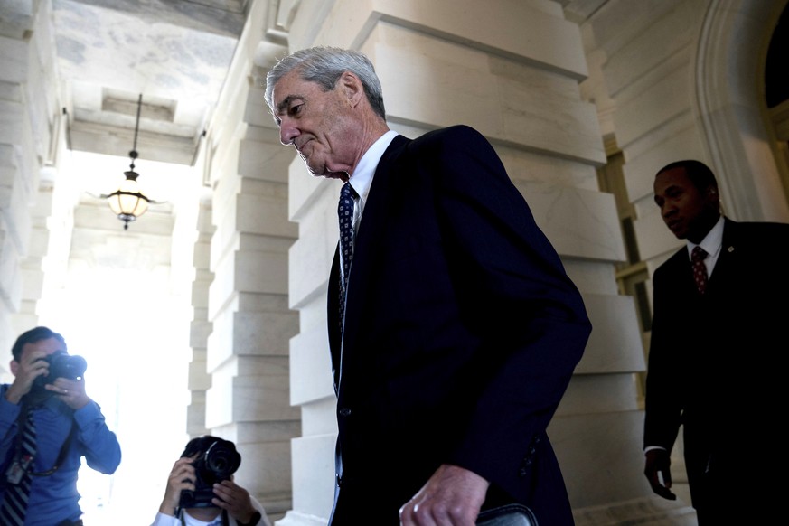 FILE - In this June 21, 2017, file photo, former FBI Director Robert Mueller, the special counsel probing Russian interference in the 2016 election, departs Capitol Hill following a closed door meetin ...