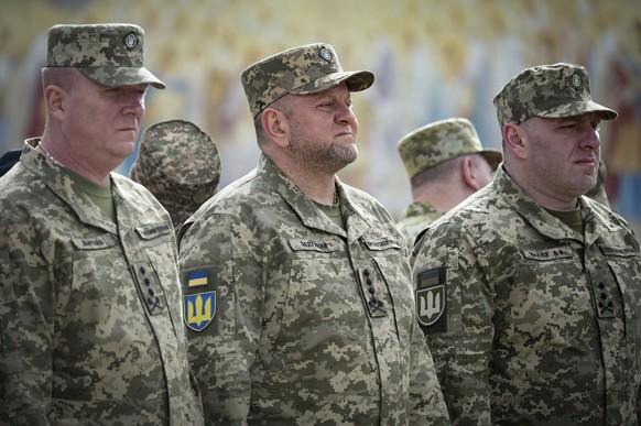 In this photo provided by the Ukrainian Presidential Press Office, Commander-in-Chief of Ukraine&#039;s Armed Forces Valeriy Zaluzhny, centre, attends an event for marking Statehood Day in Mykhailivsk ...