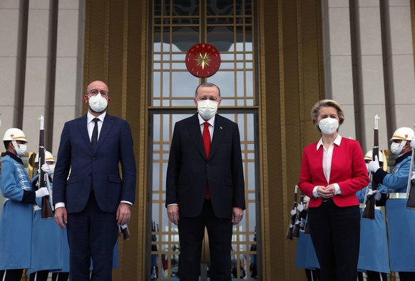 epa09118485 A handout photo made available by Turkish President Press Office shows, Turkish President Recep Tayyip Erdogan (C), EU Council President Charles Michel (L) and President of EU Commission U ...