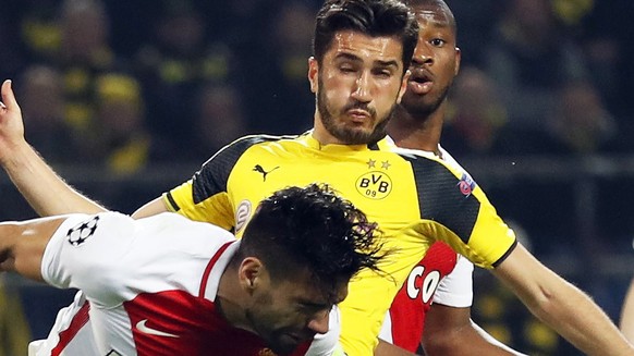 epa05904868 Borussia&#039;s Nuri Sahin (2-L) faults Monaco&#039;s captains Radamel Falcao (L) during the UEFA Champions League quarter final, first leg soccer match between Borussia Dortmund and AS Mo ...