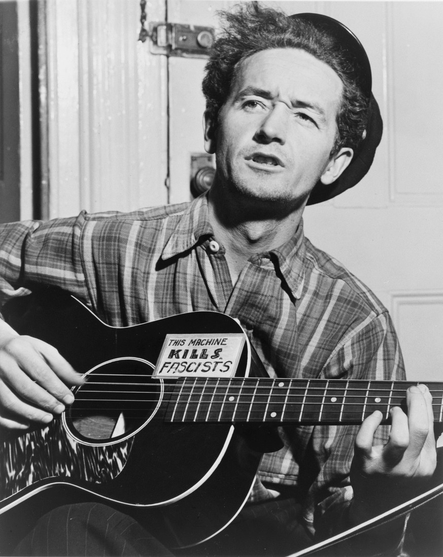 FILE - In this circa 1943 file photo courtesy of the Woody Guthrie Archives, Oklahoma-born folk singer Woody Guthrie is pictured. A dispute over the finances and control of a planned rebuild of folk l ...