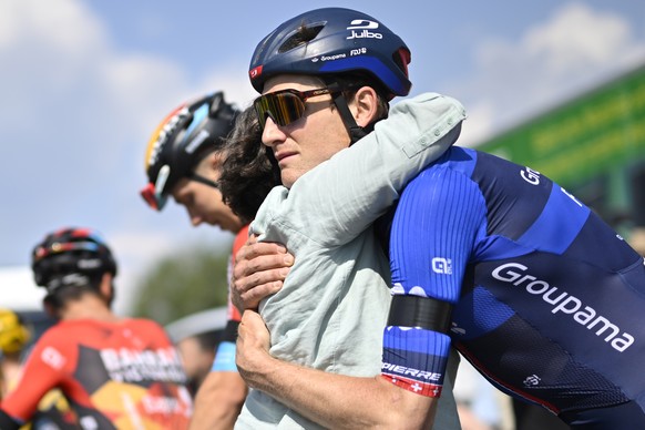 epa10695167 Stefan Kueng from Switzerland of Groupama-FDJ (R) hugs Sandra, the mother of the deceased racer Gino Maeder, after a 20 kilometres ride from Tuelersee to Oberwil-Lieli named &#039;Gino Mem ...