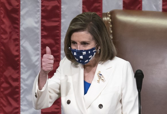 In this March 10, 2021, photo, Speaker of the House Nancy Pelosi, D-Calif., gestures after the $1.9 trillion COVID-19 relief bill was passed at the Capitol in Washington. Biden���s $1.9 trillion COVID ...