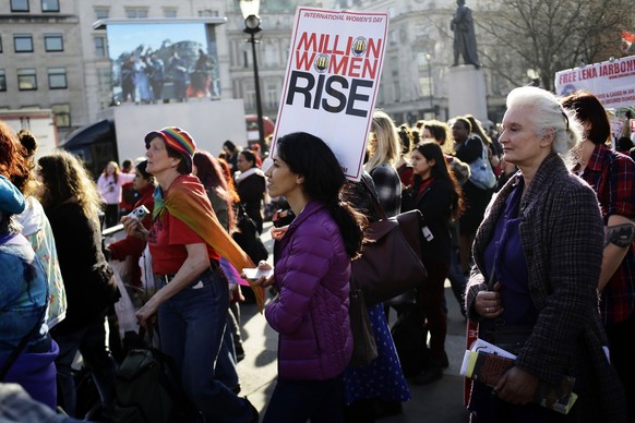 Women listen to speakers at the Million Women Rise rally in Trafalgar Square in London March 8, 2014. On March 8 activists around the globe celebrate International Women&#039;s Day, which dates back t ...