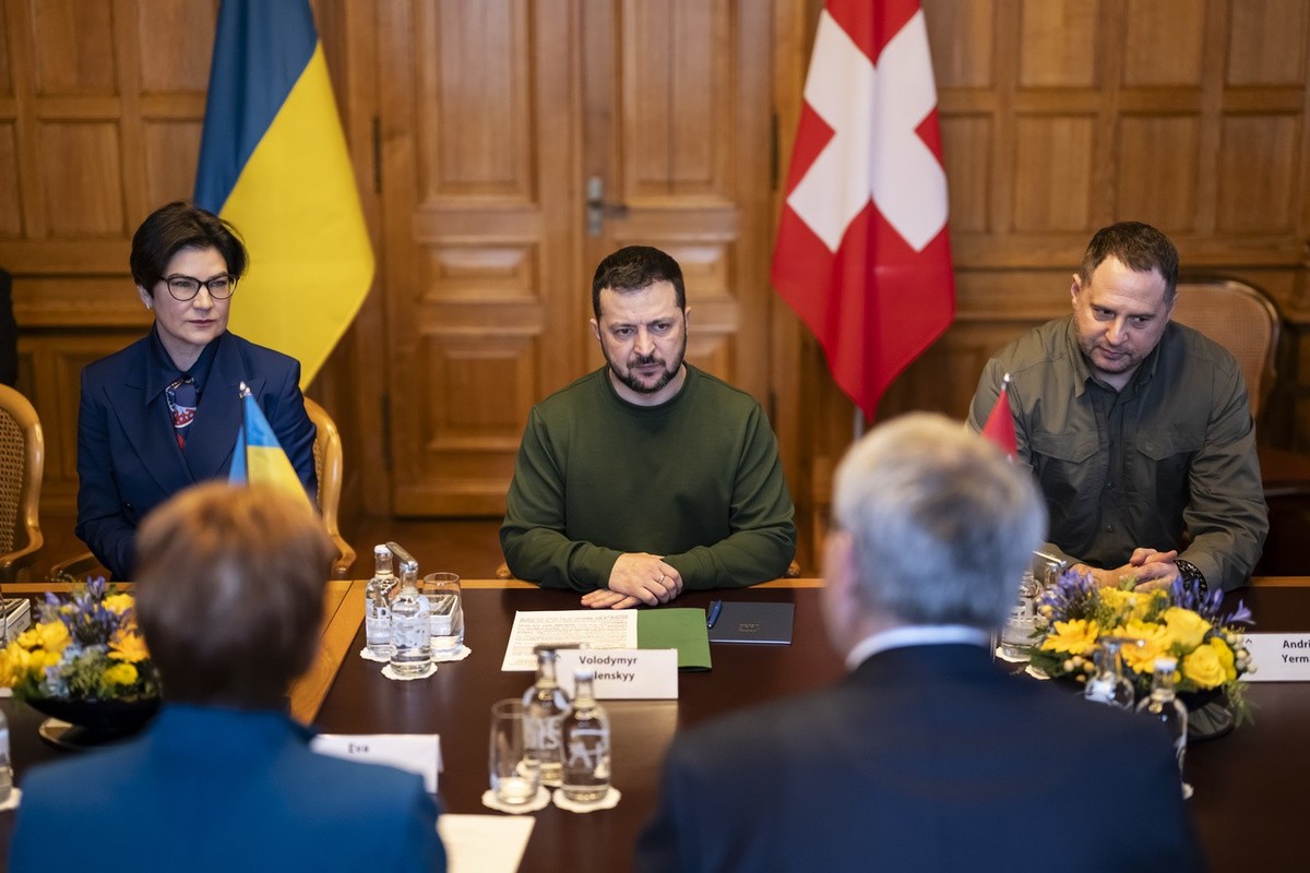 Volodymyr Zelenskyy, President of Ukraine, center, with Iryna Venediktova, Ukranian Ambassador to Switzerland, left, and Andriy Yermak, head of the Ukrainian President's Office, right, holds talk ...