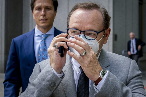 FILE - Actor Kevin Spacey appears to talk in his phone as he leaves court after testifying in a civil lawsuit, Thursday, May 26, 2022, in New York. A sex-assault civil lawsuit against Spacey can proce ...