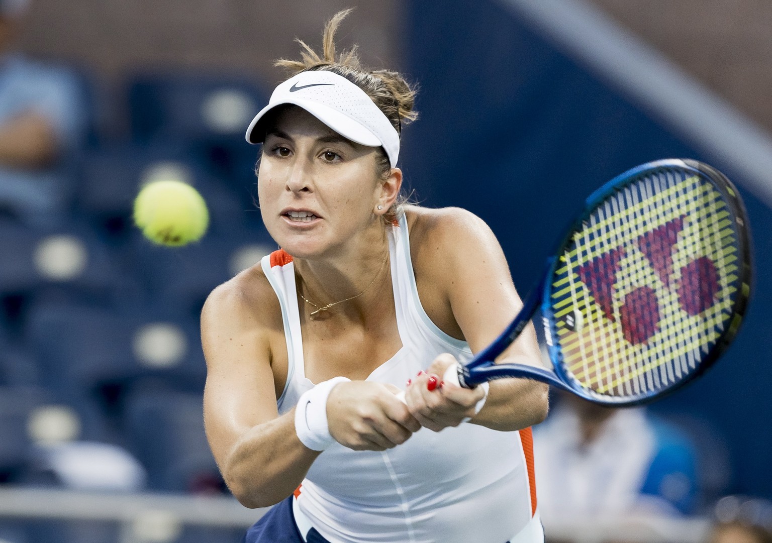 epa10158471 Belinda Bencic of Switzerland hits a return to Karolina Pliskova of the Czech Republic during their third round match of the US Open Tennis Championships at the USTA National Tennis Center ...