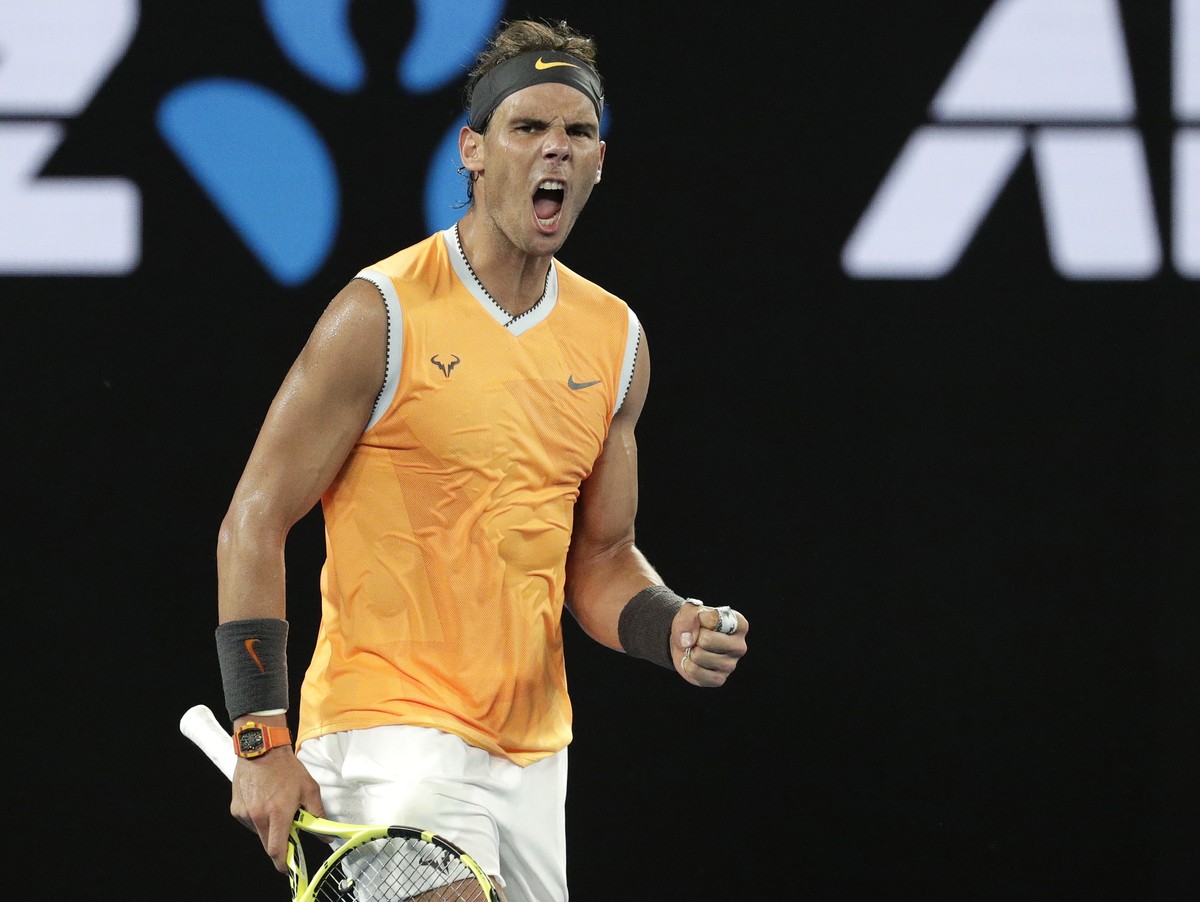 Spain's Rafael Nadal celebrates after defeating Greece's Stefanos Tsitsipas in their semifinal at the Australian Open tennis championships in Melbourne, Australia, Thursday, Jan. 24, 2019. ( ...