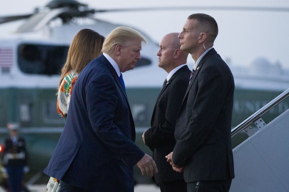 President Donald Trump, with first lady Melania Trump, walk to Air Force One as they depart Sunday, June 2, 2019, at Andrews Air Force Base, Md. Trump is going to London, France and Ireland. (AP Photo ...