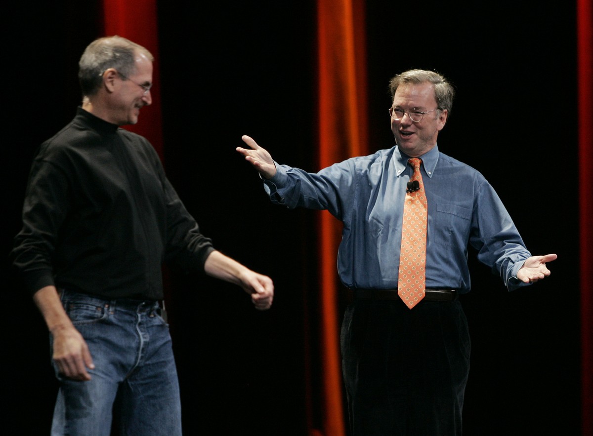 Apple CEO Steve Jobs, left, and Google CEO Eric Schmidt, right, smile as they introduce the iPhone during Jobs' keynote address at MacWorld Conference &amp; Expo in San Francisco, Tuesday, Jan. 9 ...