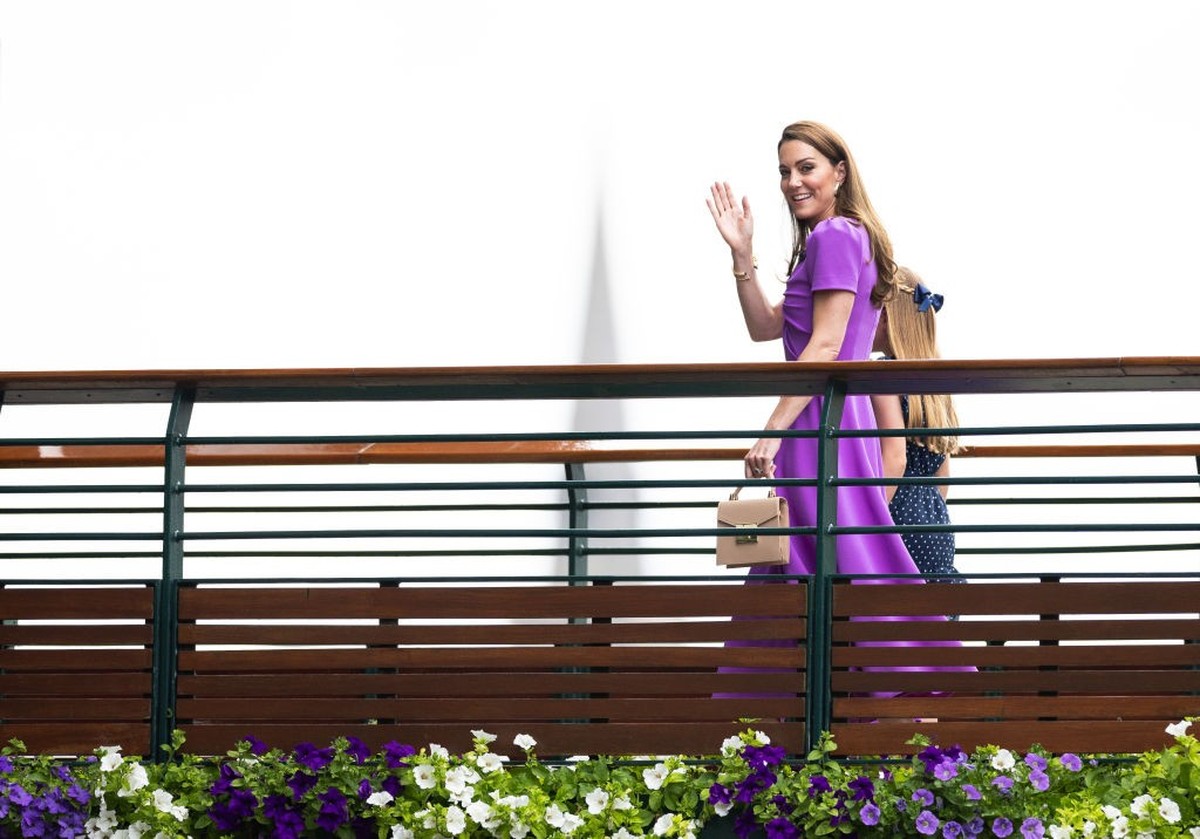 LONDON, ENGLAND - JULY 14: Catherine, Princess of Wales and Princess Charlotte of Wales walk across a bridge on the way to the Royal Box for the start of the Mens Singles Final at The Wimbledon Lawn T ...