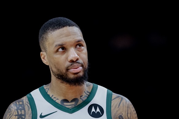 epa11941312 Milwaukee Bucks guard Damian Lillard suffered an injury to his left eye, remained in the game, during the second half of an NBA basketball game between the Milwaukee Bucks and the Atlanta  ...