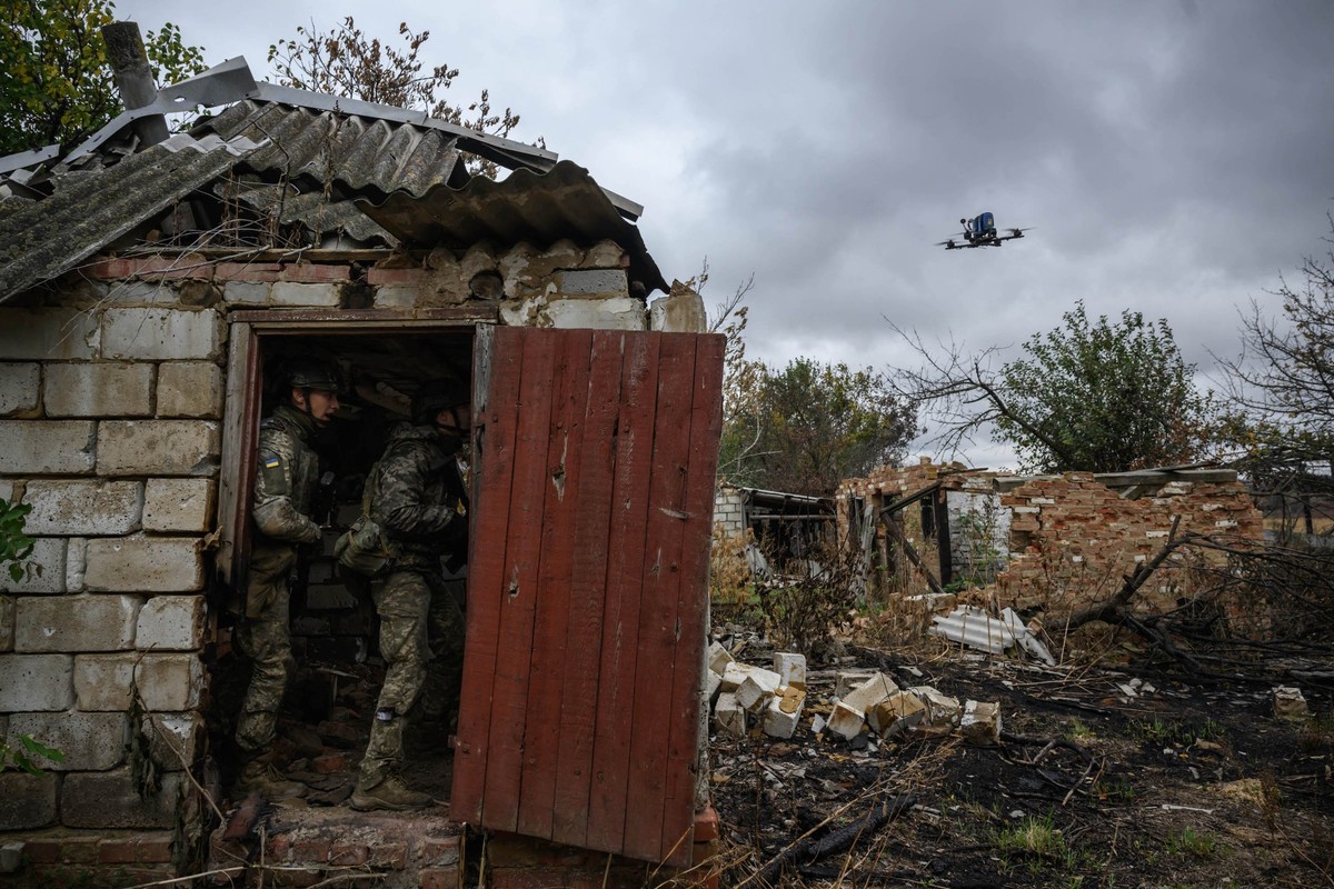 (FILES) Infantry recruits of the 28th Seperate Mechanized Brigade protect against a simulated drone attack as they undergo a basic training course at an undislosed location in eastern Ukraine on Octob ...