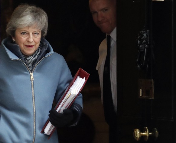 Britain&#039;s Prime Minister Theresa May leaves 10 Downing Street to attend the weekly Prime Ministers&#039; Questions session, in parliament in London, Wednesday, March 6, 2019. (AP Photo/Frank Augs ...