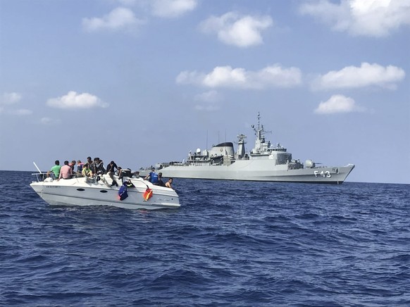 FILE - In this photo by United Nations Interim Force in Lebanon (UNIFIL), UNIFIL&#039;s flagship, BRS Liberal, approaches a boat overcrowded with migrants in the Mediterranean Sea on Oct. 12, 2018. Th ...