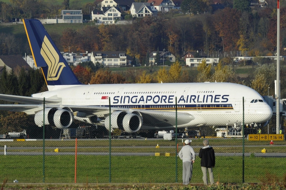A Singapore Airlines Airbus A-380 has its engine checked, at the Airport Zuerich, in Switzerland, Thursday, November 4, 2010. After a Qantas A-380 had an emergency landing in Singapore due to engine p ...