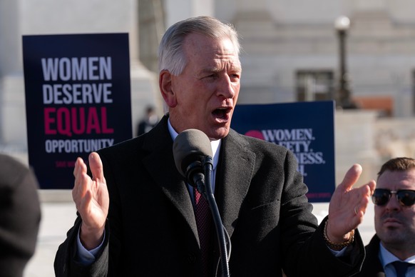 Sen. Tommy Tuberville, R-Ala., speaks to the crowd as protesters gather outside the Supreme Court as it hears arguments over state laws barring transgender girls and women from playing on school athle ...