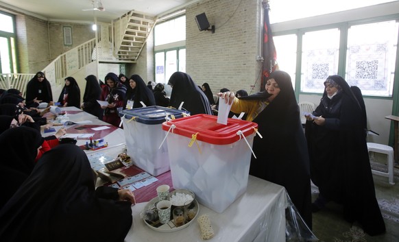 epa11190393 Veiled Iranian women cast their votes during the Iranian legislative election at a mosque in Shahre-Ray, southern Tehran, Iran, 01 March 2024. Iranians vote for new members of Iran&#039;s  ...