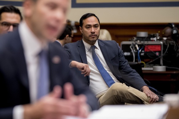 Rep. Joaquin Castro, D-Texas, center, sits in the audience as Acting Secretary of Homeland Security Kevin McAleenan, foreground, appears before a House Committee on Oversight and Reform hearing on Cap ...