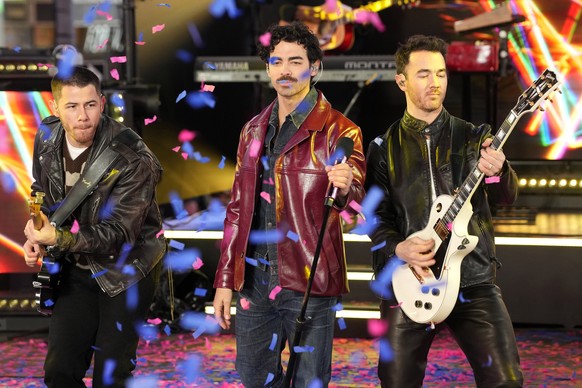 Nick Jonas, from left, Joe Jonas and Kevin Jonas from the Jonas Brothers perform during the Times Square New Year&#039;s Eve celebration on Tuesday, Dec. 31, 2024, in New York. (Photo by Charles Sykes ...