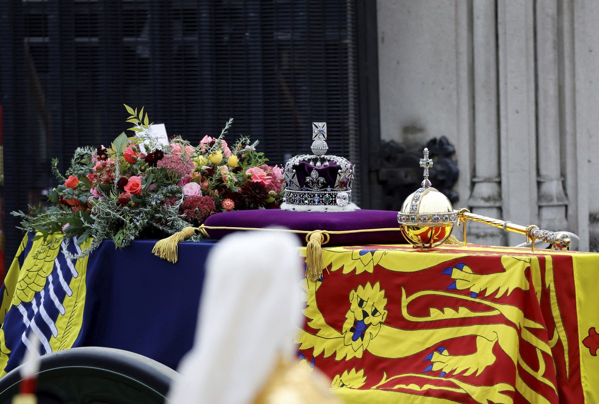 The coffin of Britain's Queen Elizabeth II is carried in the procession to Westminster Abbey for her funeral, in London, Sept. 19, 2022. (Sarah Meyssonnier/Pool Photo via AP)