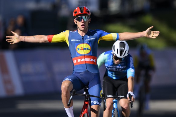 epa11300410 Thibau Nys from Belgium of team Lidl-Trek raises his arms after crossing the finish line to win the second stage, a 171,02 km race between Fribourg and Salvan / Les Marecottes at the 77th  ...