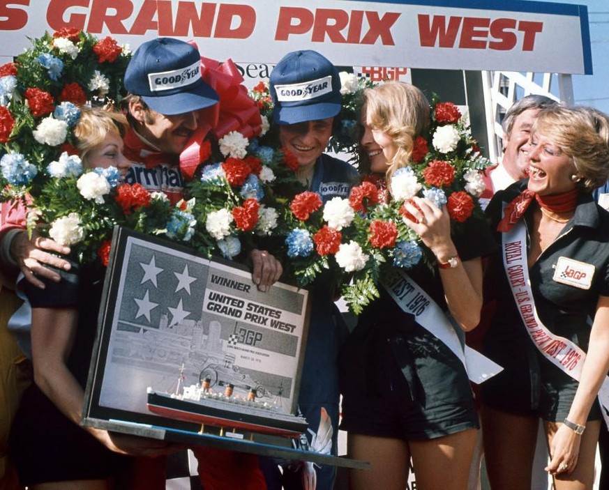 IMAGO / Motorsport Images

Long Beach, California, USA. 28th March 1976. Clay Regazzoni (Ferrari 312T), 1st position and Patrick Depallier (Tyrrell 007-Ford), 3rd position celebrate on the podium, por ...