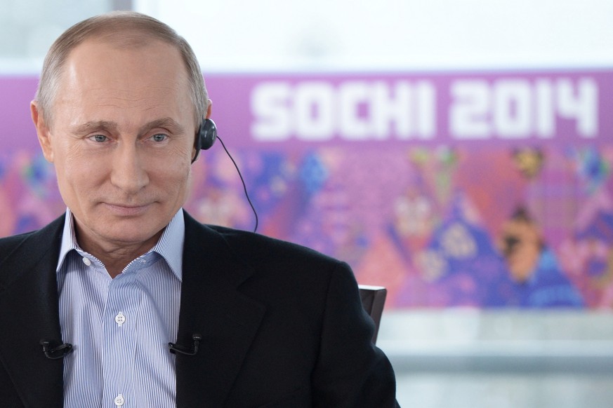 In this Friday, Jan. 17, 2014 photo made available by Presidential Press Service on Sunday, Jan. 19, 2014, Russian President Vladimir Putin listens to a translation during an interview to Russian and  ...