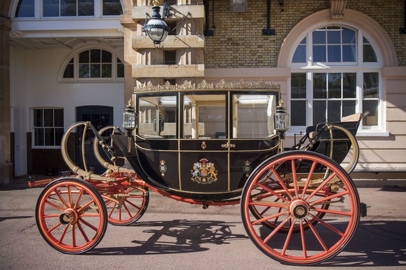The Scottish State Coach, which will be used in the case of wet weather, during preparations for the wedding of Britain&#039;s Prince Harry and Meghan Markle, in the Royal Mews at Buckingham Palace in ...