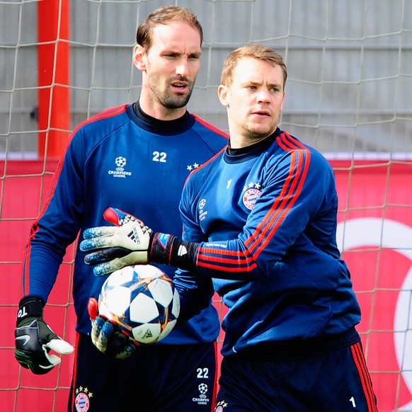 MUNICH, GERMANY - MARCH 31: Manuel Neuer (R) and Tom Starke of Muenchen in action during a training session of FC Bayern Muenchen ahead of their UEFA Champions League quarter final first leg match aga ...