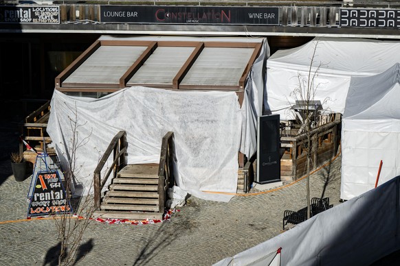 epa12625484 The entrance of the "Le Constellation" bar and lounge, is pictured, in Crans-Montana, Switzerland, 04 January 2026. At least 40 people lost their lives and over 100 were severely ...
