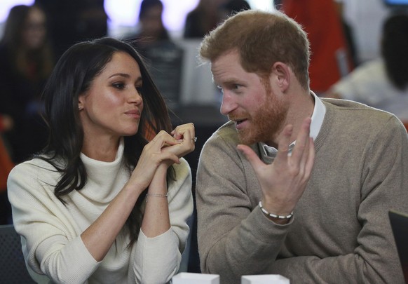 Britain&#039;s Prince Harry and Meghan Markle take part in an event as part of International Women&#039;s Day in Birmingham, central England, Thursday, March 8, 2018. (Ian Vogler/Pool via AP)