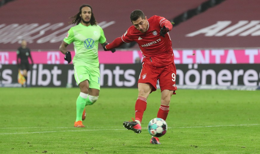 epa08888746 Robert Lewandowski of Bayern Munich scores their team&#039;s second goal during the Bundesliga match between FC Bayern Muenchen and VfL Wolfsburg at Allianz Arena in Munich, Germany, 16 De ...