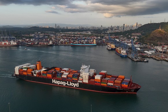 FILE -A cargo ship sails past the Panama Canal's Port of Balboa, managed by CK Hutchison Holdings, in Panama City, March 13, 2025. (AP Photo/Matias Delacroix, File)
