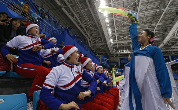 epa06518171 North Korean sing and dance between periods against Sweden inside the Kwandong Hockey Centre at the PyeongChang Winter Olympic Games 2018, in Gangneung, South Korea, 12 February 2018. EPA/ ...