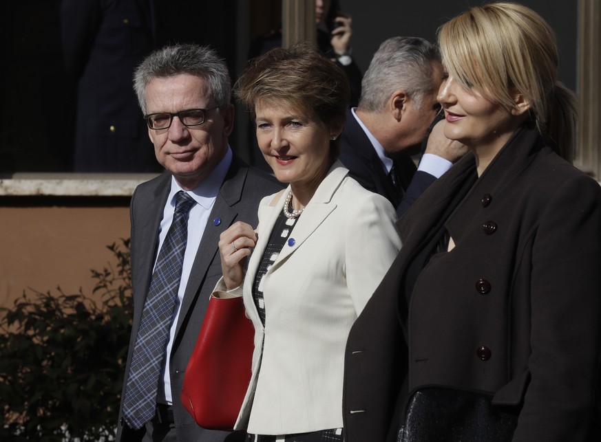 From left, German Interior Minister Thomas de Maiziere, Swiss Interior Minister Simonetta Sommaruga and Slovenia&#039;s Interior Minister Vesna Gyoerkoes Znidar, arrive for a meeting of interior minis ...