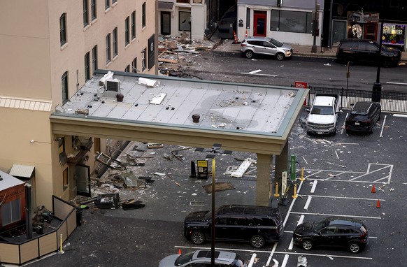 Debris is seen near the Sandman Signature hotel after an explosion on Monday, Jan. 8, 2023, in Fort Worth, Texas. (Amanda McCoy/Star-Telegram via AP)