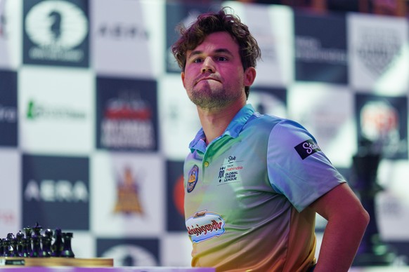 epa11639869 Magnus Carlsen sits down to play against Viswanathan Anand in the first round of Global Chess League Season 2, Ganges Grandmasters against Alpine SG Pipers, at Friends House in London, Bri ...