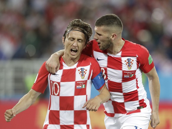 Croatia&#039;s Luka Modric, left, celebrates with teammate Ante Rebic after scoring from a penalty spot during the group D match between Croatia and Nigeria at the 2018 soccer World Cup in the Kalinin ...