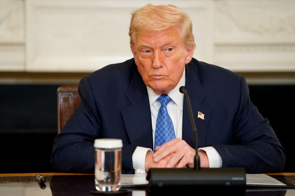 epa12290514 US President Donald Trump attends a signing ceremony in the State Dining Room of the White House in Washington, DC, USA, 08 August 2025. US President Trump said he would host the leaders o ...