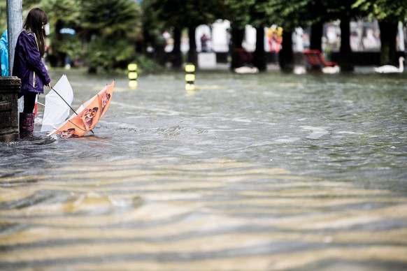epa08719975 The shore area of Locarno is under water after the water level of Lake Maggiore rose to 195.47 meters due to the heavy rainfalls of the last few days, in Locarno, Switzerland, 04 October 2 ...