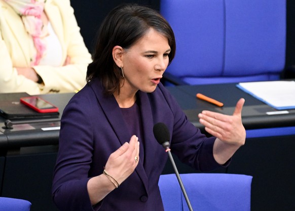 epa09911985 German Federal Foreign Minister Annalena Baerbock speaks during a session of the German Parliament in Berlin, Germany, 27 April 2022. The German government takes questions from deputies in ...