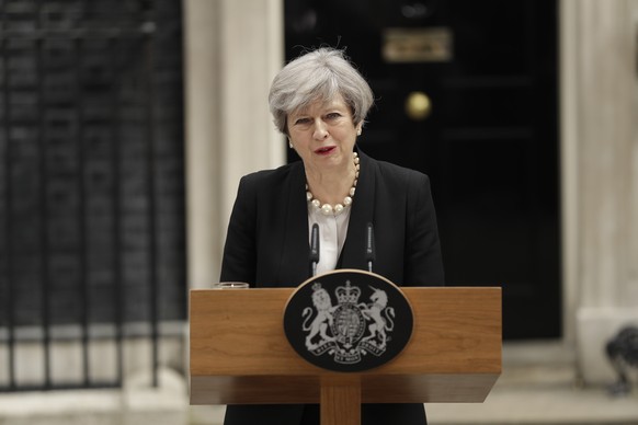 British Prime Minister Theresa May addresses the media outside 10 Downing Street, London, Tuesday May 23, 2017, the day after an apparent suicide bomber attacked an Ariana Grande concert as it ended M ...