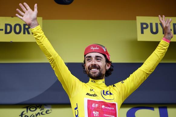 KEYPIX - epa12237804 Irish rider Ben Healy of EF Education - EasyPost team celebrates on the podium with the Yellow leader jersey during the 10th stage of the Tour de France cycling race over 165.3km  ...