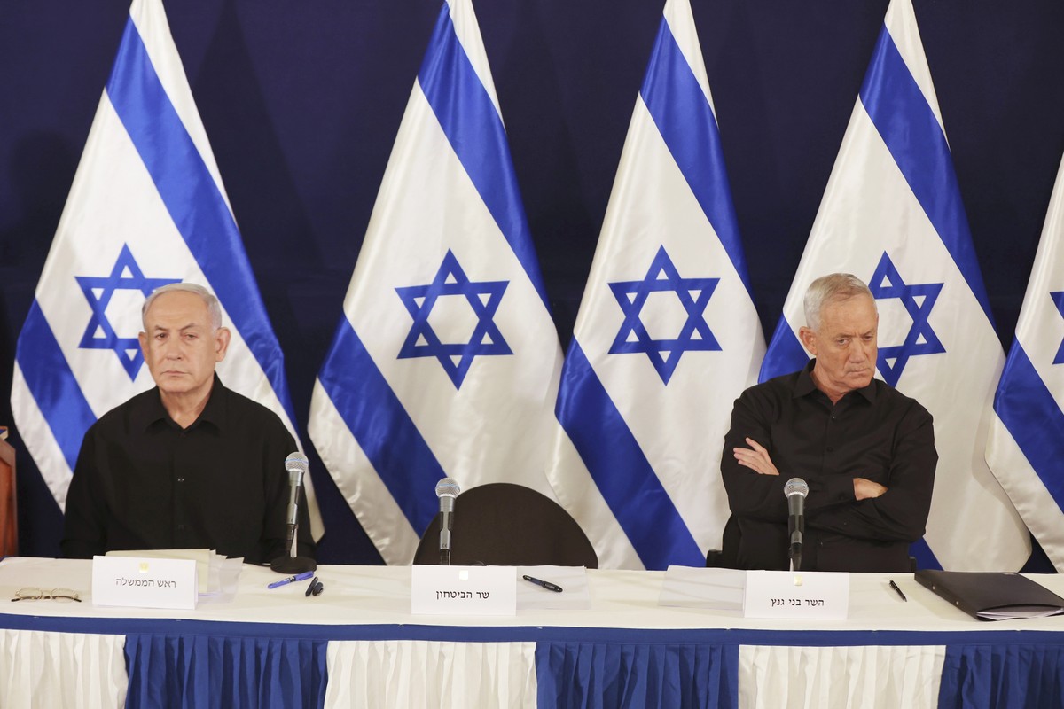 Israeli Prime Minister Benjamin Netanyahu and Cabinet Minister Benny Gantz during a press conference in the Kirya military base in Tel Aviv, Israel, Saturday, Oct. 28, 2023. (Abir Sultan/Pool Photo vi ...