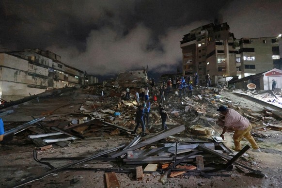 Rescue workers search through the rubble after an earthquake in Caracas, Venezuela, Wednesday, June 24, 2026. (AP Photo/Javier Campos)
Venezuela Earthquake