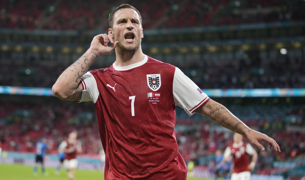 Austria's Marko Arnautovic, celebrates after scoring a VAR deleted goal during the Euro 2020 soccer championship round of 16 match between Italy and Austria at Wembley stadium in London, Saturday ...