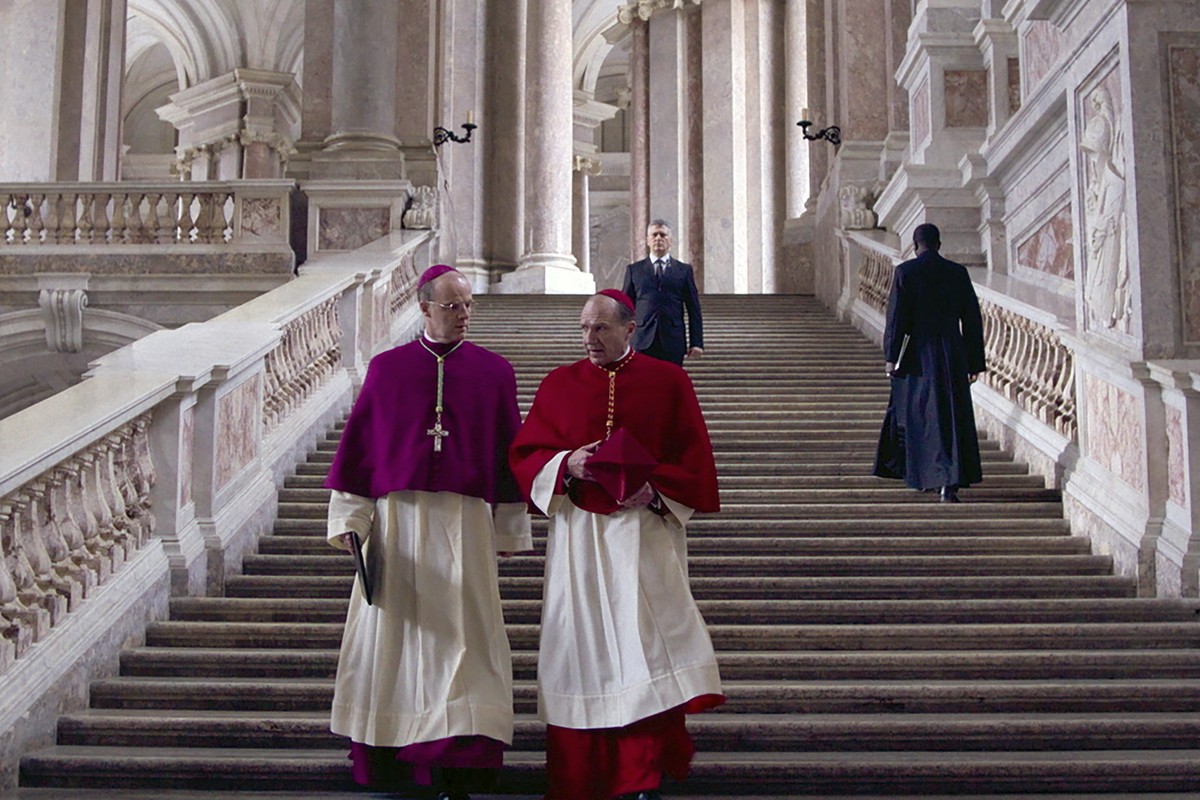 This image released by Focus Features shows Br�an F. O'Byrne, left, and Ralph Fiennes in a scene from "Conclave." (Focus Features via AP)
