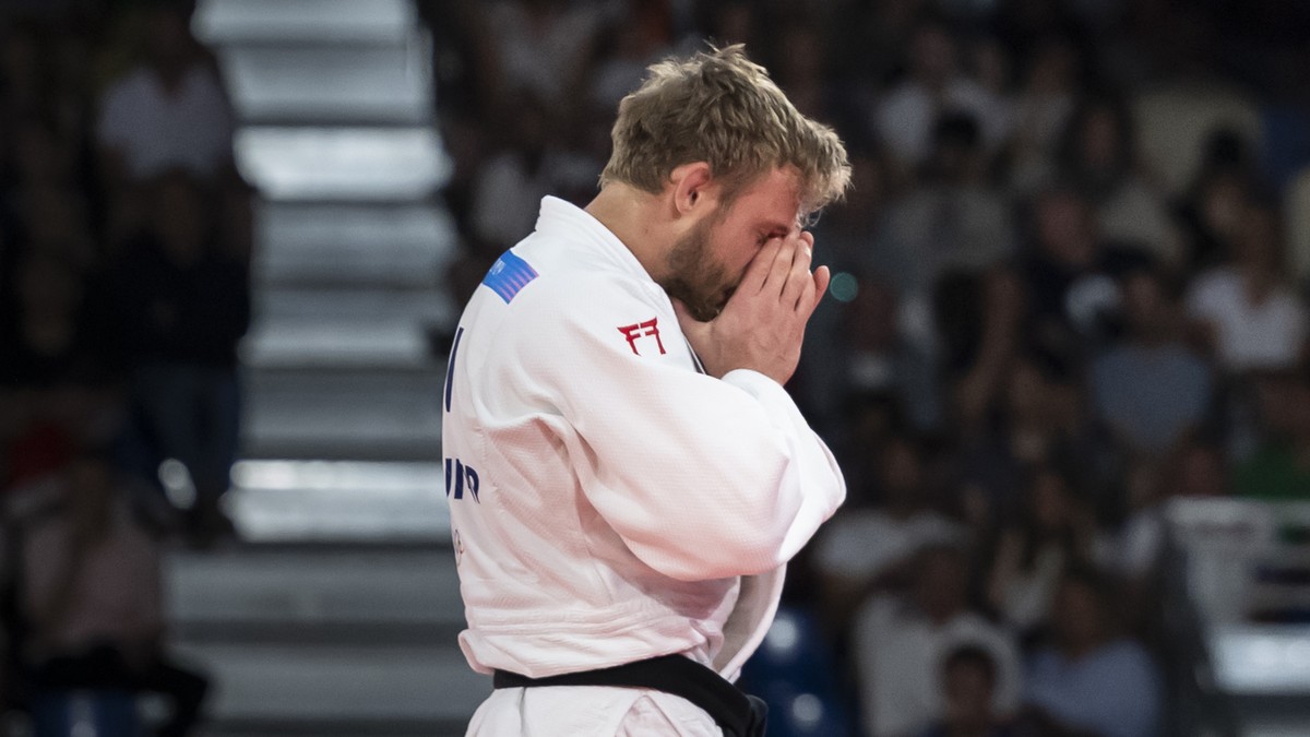 Switzerland's Nils Stump looks disappointed after losing her fight against Mongolia's Erdenebayar Batzaya (not pictured) during the Judo Men 73 kg Elimination Round of 32 at the 2024 Paris S ...