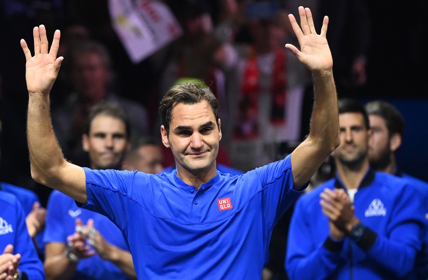 epa10365009 epa10202794 Team Europe player Roger Federer of Switzerland waves to the crowd after playing the doubles match with Rafael Nadal (rear L) of Spain against Team World double Jack Sock of th ...